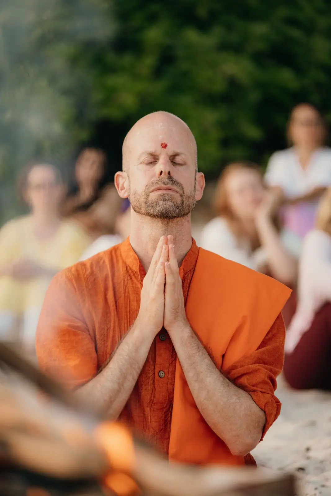 Swami Shambhudevananda in meditation, hands joined in prayer
